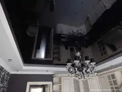 Black glossy stretch ceiling in the kitchen photo