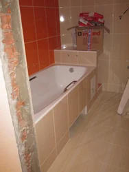 Box in the bathroom covers the pipes photo