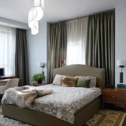 Corner bedroom with two windows photo