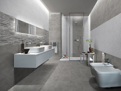 Gray porcelain tiles in the bathroom design photo