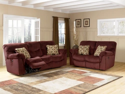 Burgundy color of the sofa in the living room interior photo