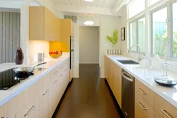 Small narrow kitchen design photo with refrigerator