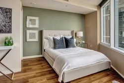 How to position the bed in the bedroom relative to the window photo