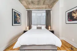 How to position the bed in the bedroom relative to the window photo