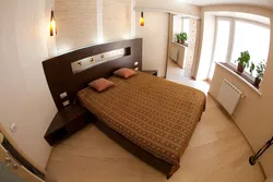 How to position the bed in the bedroom relative to the window photo