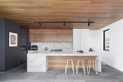 Marble and wood in the kitchen interior photo