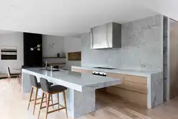 Marble and wood in the kitchen interior photo