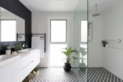 Black floor white walls photo of bathrooms