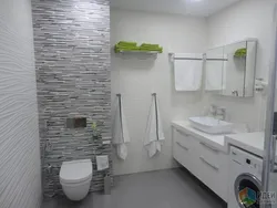 Design of a small bathroom with a toilet in gray tones