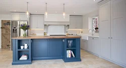 Blue kitchen with wooden countertops in the interior photo