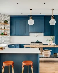 Blue kitchen with wooden countertops in the interior photo