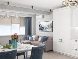 Design of a combined kitchen and living room in white