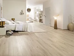 What kind of floors are in the bedroom photo