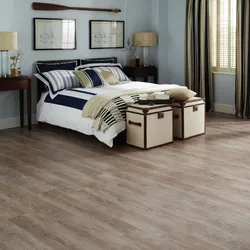 What kind of floors are in the bedroom photo