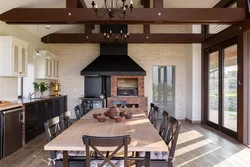 Kitchen with stove in a country house design photo