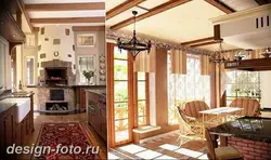 Kitchen with stove in a country house design photo
