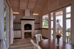 Kitchen with stove in a country house design photo