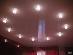 Design of lamps on a suspended ceiling in the bedroom