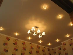 Design of lamps on a suspended ceiling in the bedroom