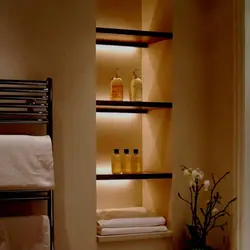 Niche with shelves near the bathtub photo