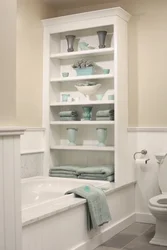 Niche with shelves near the bathtub photo