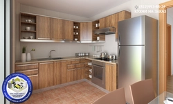 Photo of a kitchen with a right corner and a refrigerator