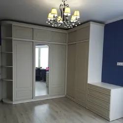 Corner cabinets in the living room in the interior photo