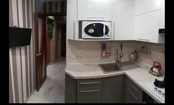 Interior of a small kitchen with a washing machine