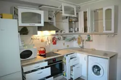 Interior of a small kitchen with a washing machine