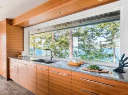 Kitchen in a house with panoramic windows design photo