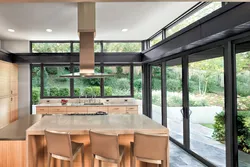 Kitchen in a house with panoramic windows design photo