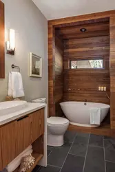 Bathroom with toilet in a wooden house design photo