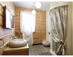 Bathroom with toilet in a wooden house design photo