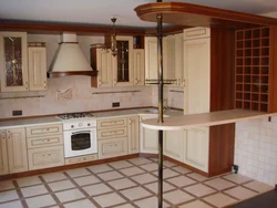 Photo of a kitchen with bar counters all made of wood