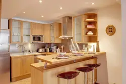 Photo of a kitchen with bar counters all made of wood