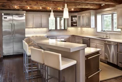 Photo of a kitchen with bar counters all made of wood