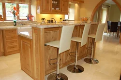 Photo Of A Kitchen With Bar Counters All Made Of Wood