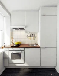 Interior of a small kitchen with a refrigerator