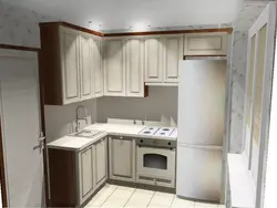 Interior of a small kitchen with a refrigerator