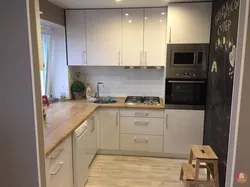 Design of a small kitchen photo sq m with a refrigerator