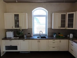 Kitchen where the window is in the interior