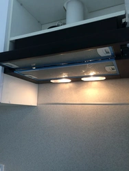 Extractor hood in kitchen set photo