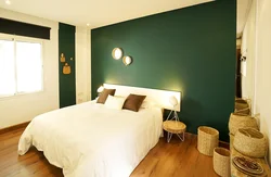 Bedroom interior with green wallpaper photo