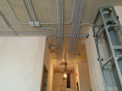 Photo of wiring on the ceiling in the apartment