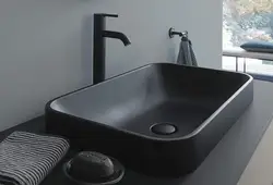 Bathroom with black sink photo