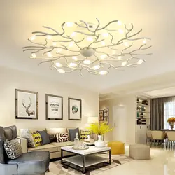Chandeliers and lamps in the living room interior photo