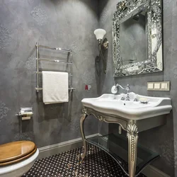 Bathtub with decorative plaster and tiles photo