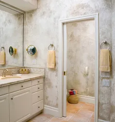 Bathtub with decorative plaster and tiles photo