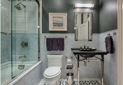 Bathtub with decorative plaster and tiles photo
