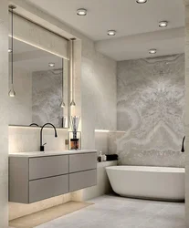 Bathtub with decorative plaster and tiles photo